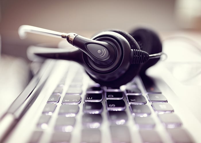 stock-photo-voip-headset-on-laptop-computer-keyboard-concept-for-communication-it-support-call-center-and-366626837